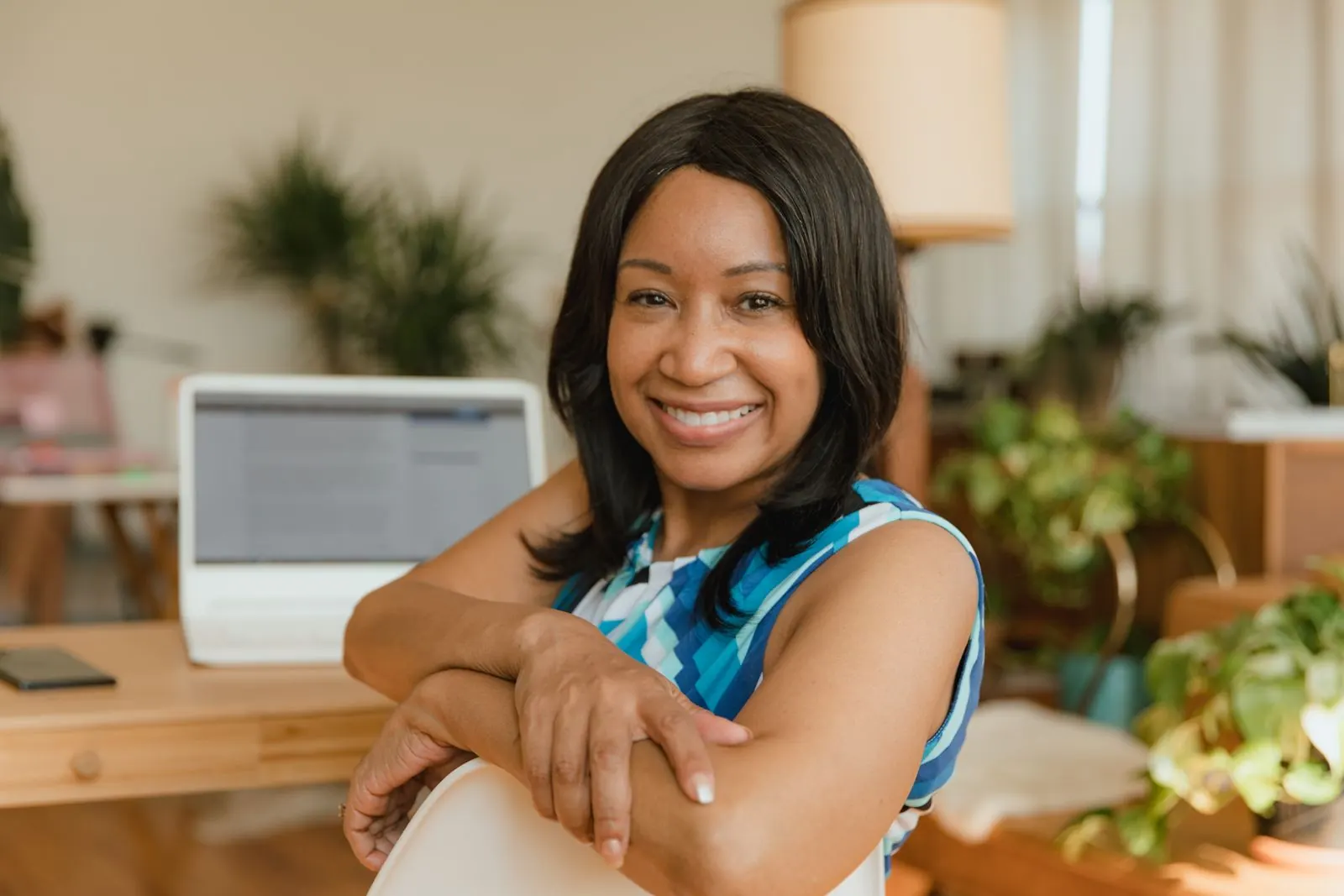 An association director at her desk in a bright office.
